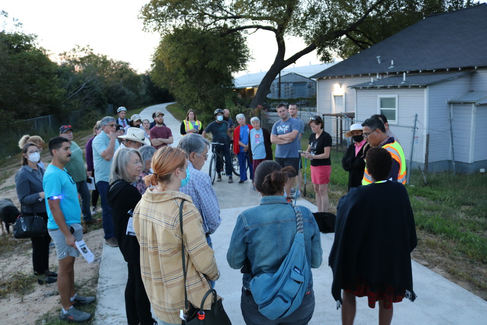 picture of residents at the trail head, listening to the Transportation Department's presentation