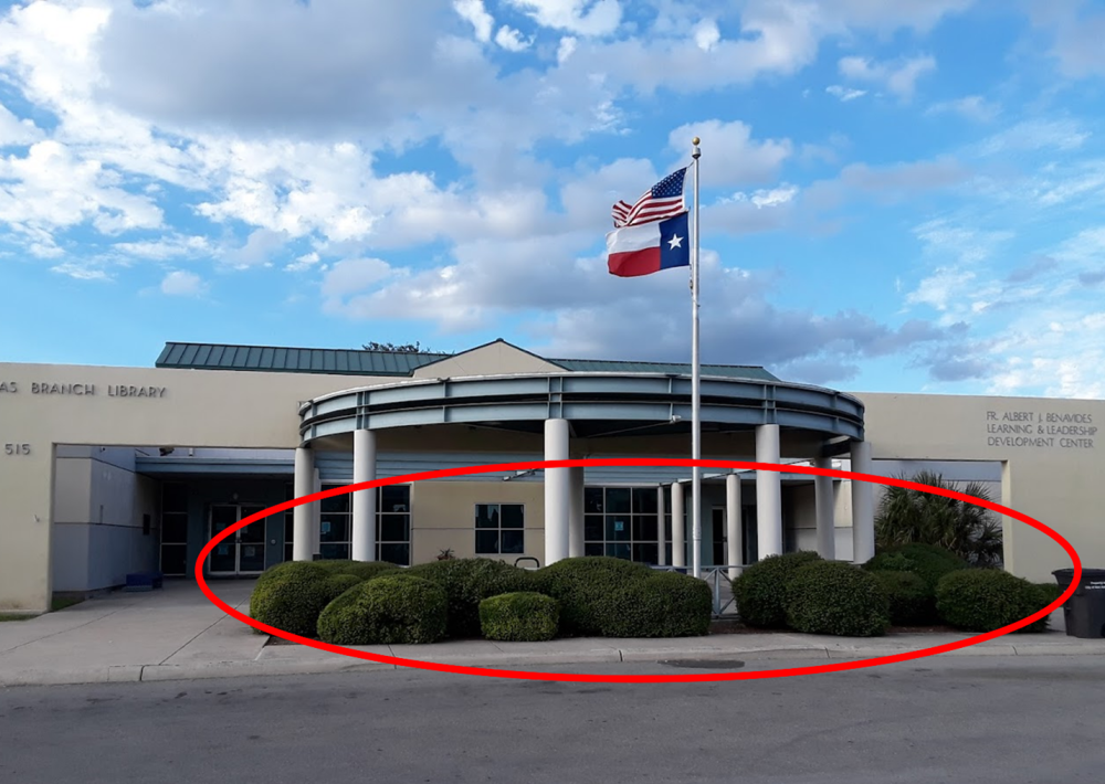 This photo shows the front of the Las Palmas Library building. A red circle indicates the public art project site location at 515 Castroville Rd, San Antonio, Texas 78237.