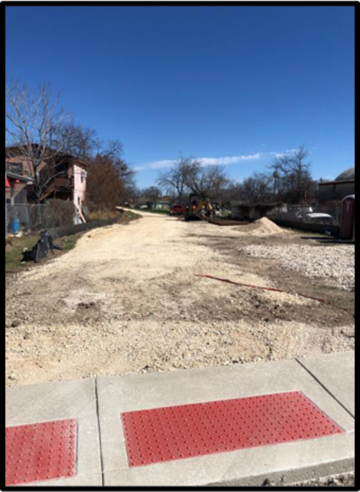 image of pathway off Applewhite that shows where future concrete path will begin