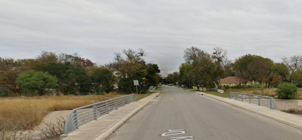 This photo shows the Peggy Drive and Eunice Street from Street view. The two silver railings are the public art project location. 